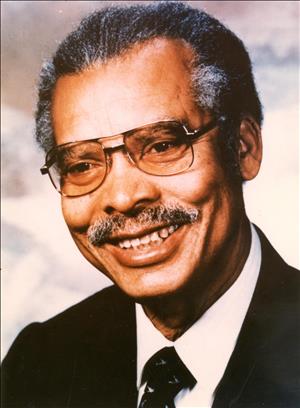 A portrait of a smiling Black elderly man